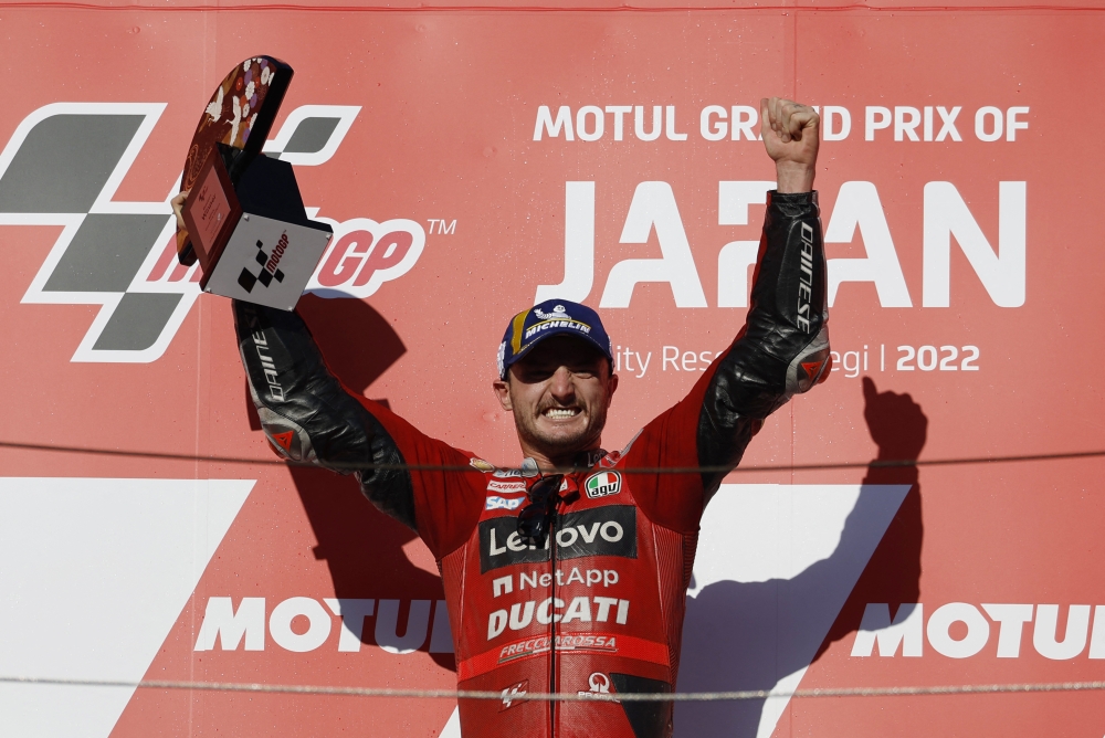 September 25, 2022 Ducati Lenovo's Jack Miller lifts the trophy as he celebrates on the podium after winning the race REUTERS/Issei Kato