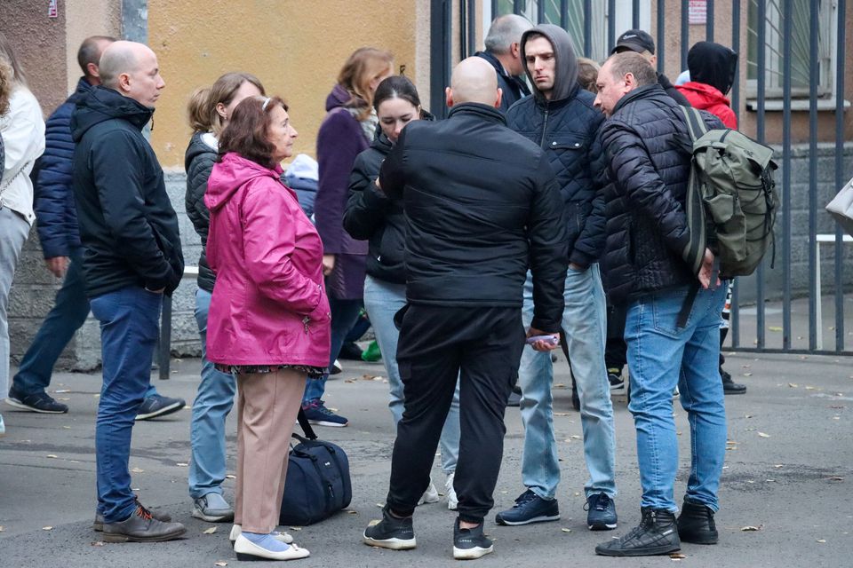 Men drafted into the Russian army during partial mobilisation say goodbye to their relatives and acquaintances outside a military commissariat in Moscow on September 23, 2022. Moscow News Agency/Handout via REUTERS