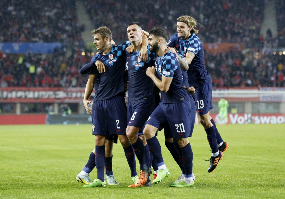 Croatia's Dejan Lovren celebrates scoring their third goal with teammates during the UEFA Nations League Group A  match against Austria at the Ernst Happel Stadium, Vienna, Austria, on September 25, 2022.  REUTERS/Lisa Leutner
 