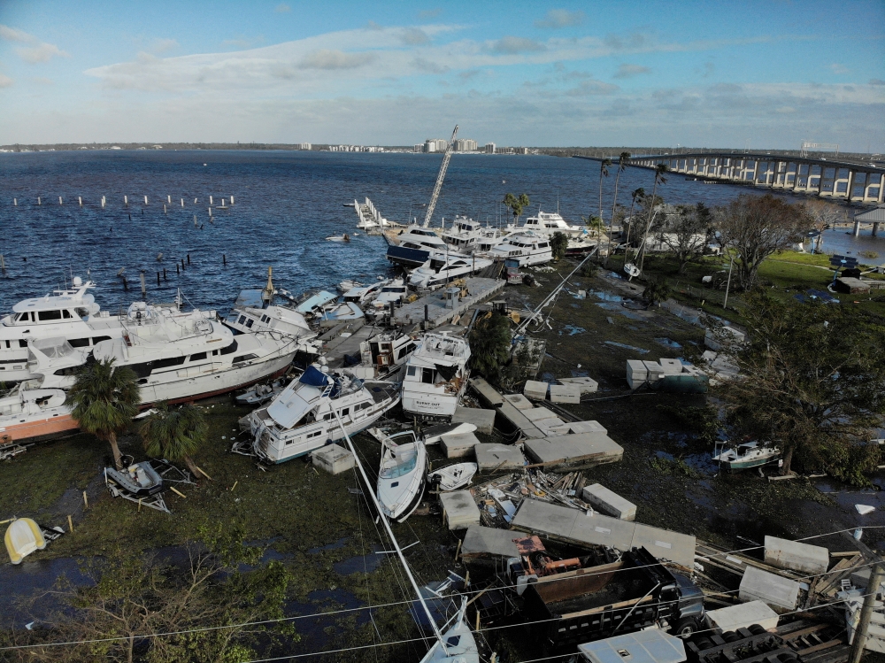 Damaged boats are seen downtown after Hurricane Ian caused widespread destruction in Fort Myers, Florida, on September 29, 2022. REUTERS/Marco Bello 