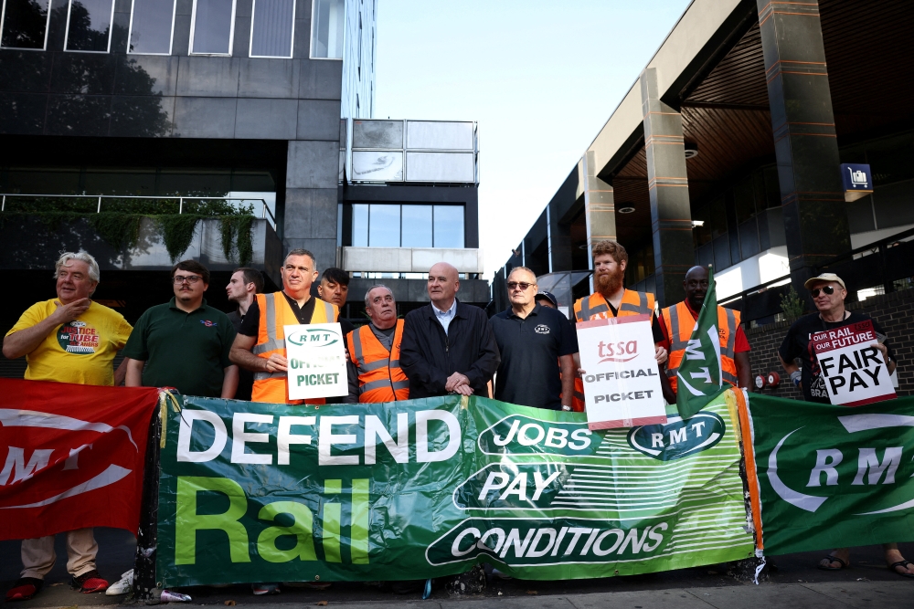 Mick Lynch, General Secretary of the National Union of Rail, Maritime and Transport Workers joins other union members on strike at a picket line outside Euston railway station in London, Britain, on August 20, 2022. File Photo / Reuters
