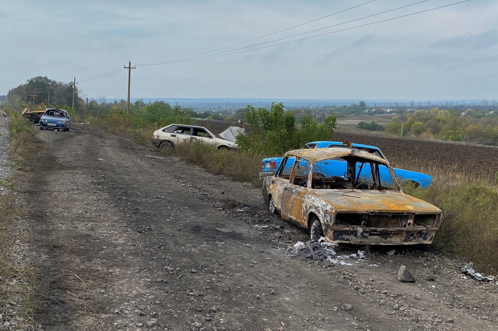 Cars from a civilian convoy, which Ukrainian State Security Service say was hit by a shelling from Russian troops amid Russia's attack on Ukraine, are seen near the village of Kurylivka in Kharkiv region, Ukraine, on October 1, 2022. REUTERS/Vitalii Hnidyi