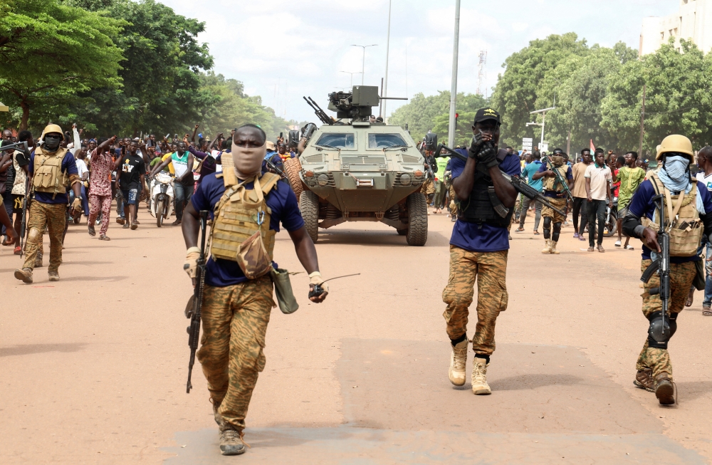 Soldiers escort the convoy of Burkina Faso's self-declared new leader Ibrahim Traore as he arrives at the national television standing in an armoured vehicle in Ouagadougou, Burkina Faso, on October 2, 2022. File Photo / Reuters
