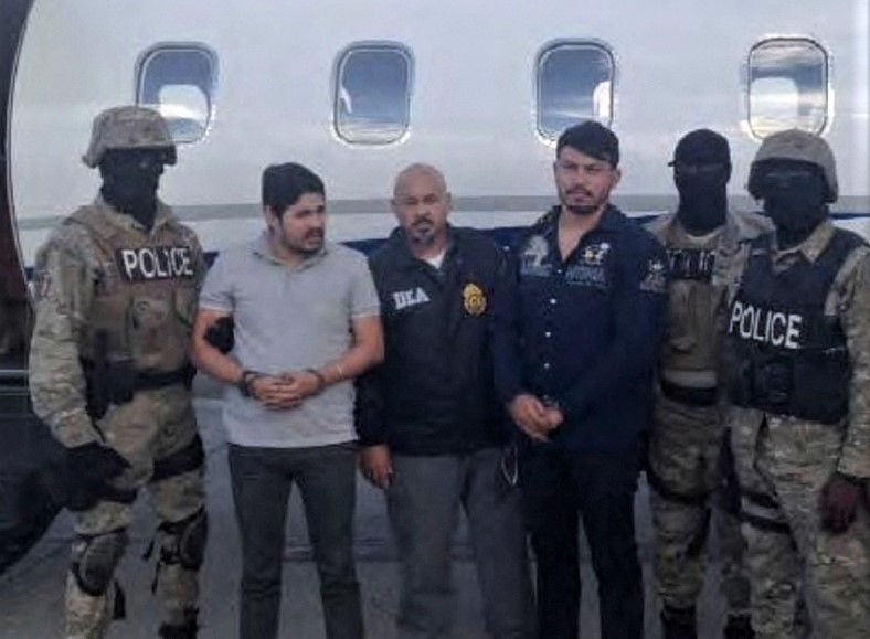 File Photo: Efrain Antonio Campo Flores (2nd from left) and Franqui Fancisco Flores de Freitas with law enforcement officers in this November 12, 2015 photo after their arrest in Port Au Prince, Haiti. (Reuters)