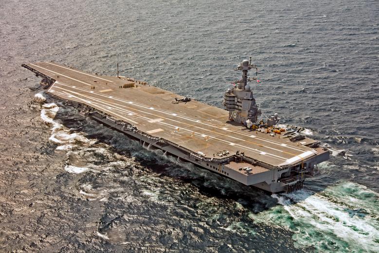 A US Navy F/A-18F Super Hornet approaches the USS Gerald R. Ford to use the new AAG arrested landing system. File Photo / Reuters