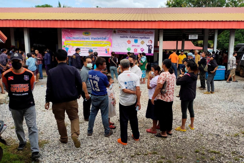 People gather outside of a daycare center's scene of a mass shooting. Sakdipat Boonsom/Handout via Reuters