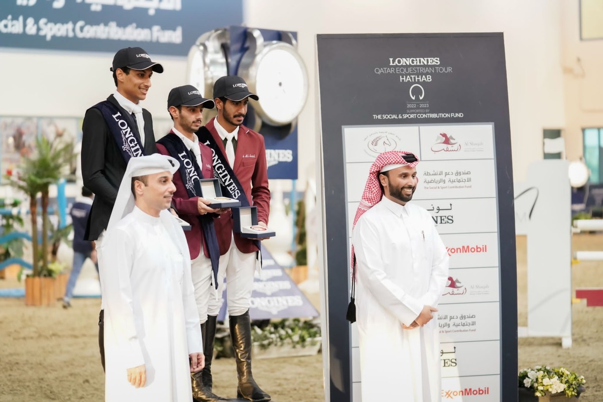 Commercial Director of Al Shaqab and Vice-President of the Higher Organising Committee of Longines Hathab Qatar Equestrian Tour Omar Al Mannai and Al Shaqab Equine Education Acting Manager Mohamad Jaber Al Khayarin pose for a photograph with the podium winners of Small Tour, yesterday. 