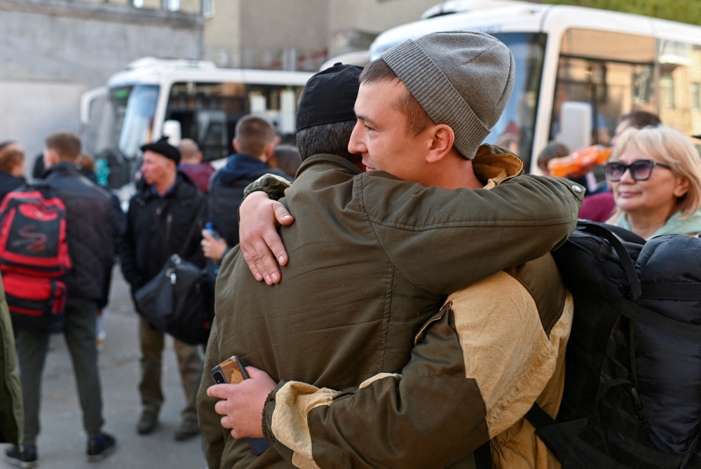 Russian reservists bid farewell to relatives and acquaintances before their departure for a base in the course of partial mobilization of troops, aimed to support the country's military campaign in Ukraine, in Omsk, Russia October 7, 2022. REUTERS/Alexey Malgavko/File Photo