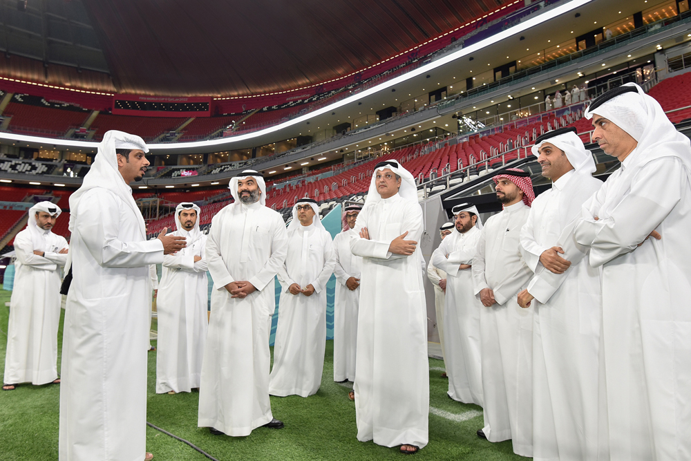 Minister of Communications and Information Technology in the Kingdom of Saudi Arabia H E Eng. Abdullah Alswaha (foreground second left); Minister of Communications and Information Technology H E Mohammed bin Ali bin Mohammed Al Mannai (foreground third left), along with other officials during a visit Al Bayt Stadium.