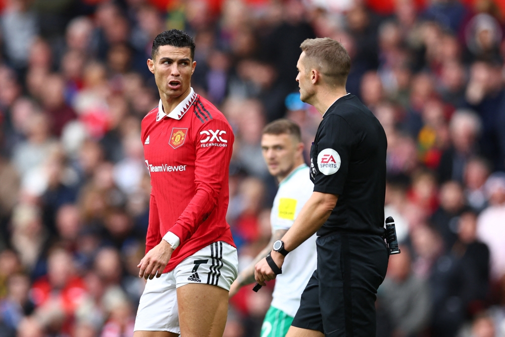 Manchester United's Cristiano Ronaldo reacts after he is shown a yellow card by referee Craig Pawson during their EPL match against Newcastle United at the Old Trafford, Manchester, Britain, on October 16, 2022. REUTERS/David Klein 