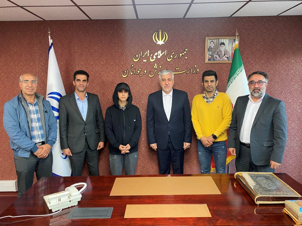 Iran's Minister of Youth Affairs and Sports Hamid Sajjadi meets with Iranian climber Elnaz Rekabi in Tehran, Iran, on October 19, 2022. Office of Iran's Sports Ministry/WANA (West Asia News Agency)/Handout via REUTERS