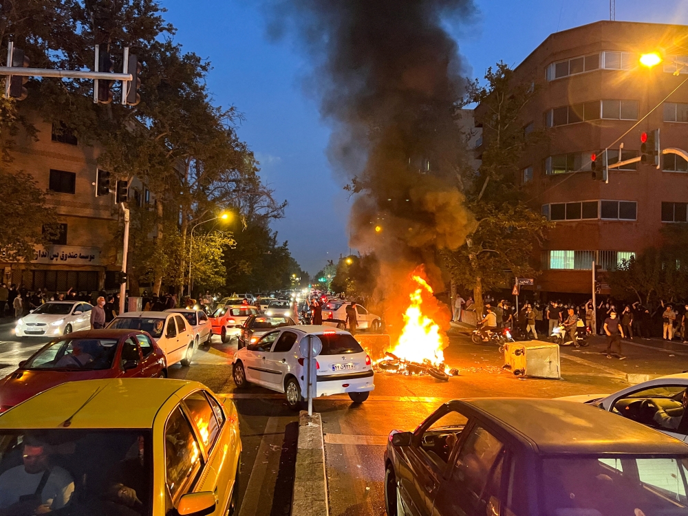 A police motorcycle burns during a protest over the death of Mahsa Amini in Tehran, Iran, on September 19, 2022. File Photo / Reuters