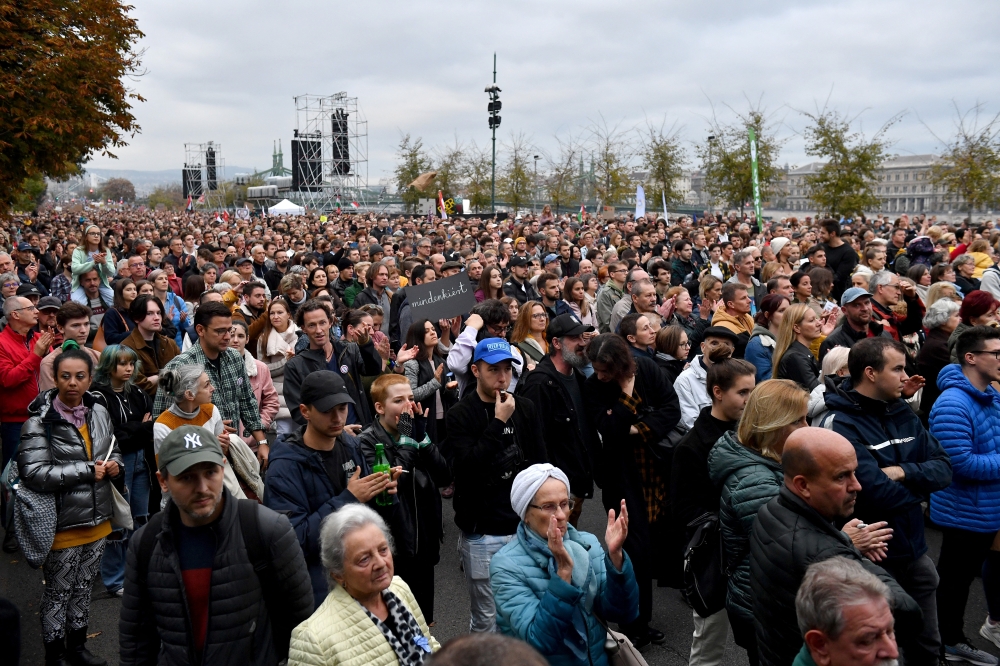 People take part in a protest in support of teachers fighting for higher wages and those who have been sacked for protesting, during the celebrations of the 66th anniversary of the Hungarian Uprising of 1956, in Budapest, Hungary, on October 23, 2022. REUTERS/Marton Monus