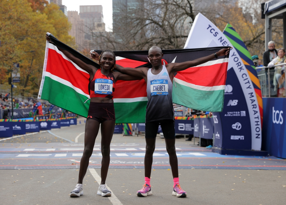 Kenya's Sharon Lokedi and Kenya's Evans Chebet pose after winning the elite women's race and elite men's race respectively at the 2022 TCS New York City marathon in New York, US, November 6, 2022. (REUTERS/Andrew Kelly)