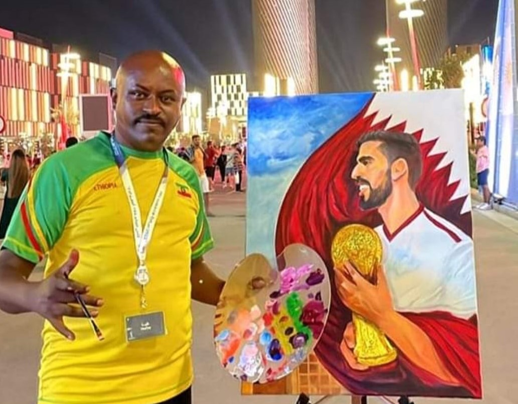 Doha-based Ethiopian artist Tessema Asrate during a live painting performance at Lusail Boulevard on November 14, 2022.