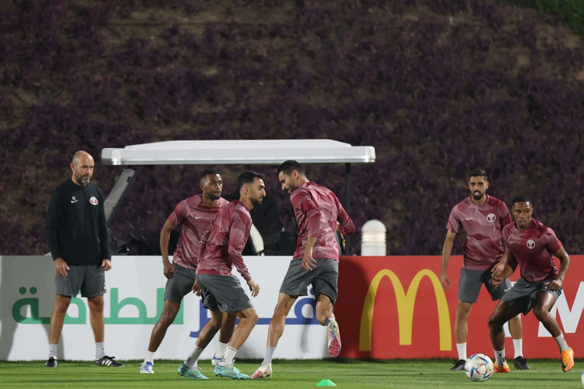 Coach Felix Sanchez watches Qatar players take part in a training session at Aspire Training Site, yesterday.