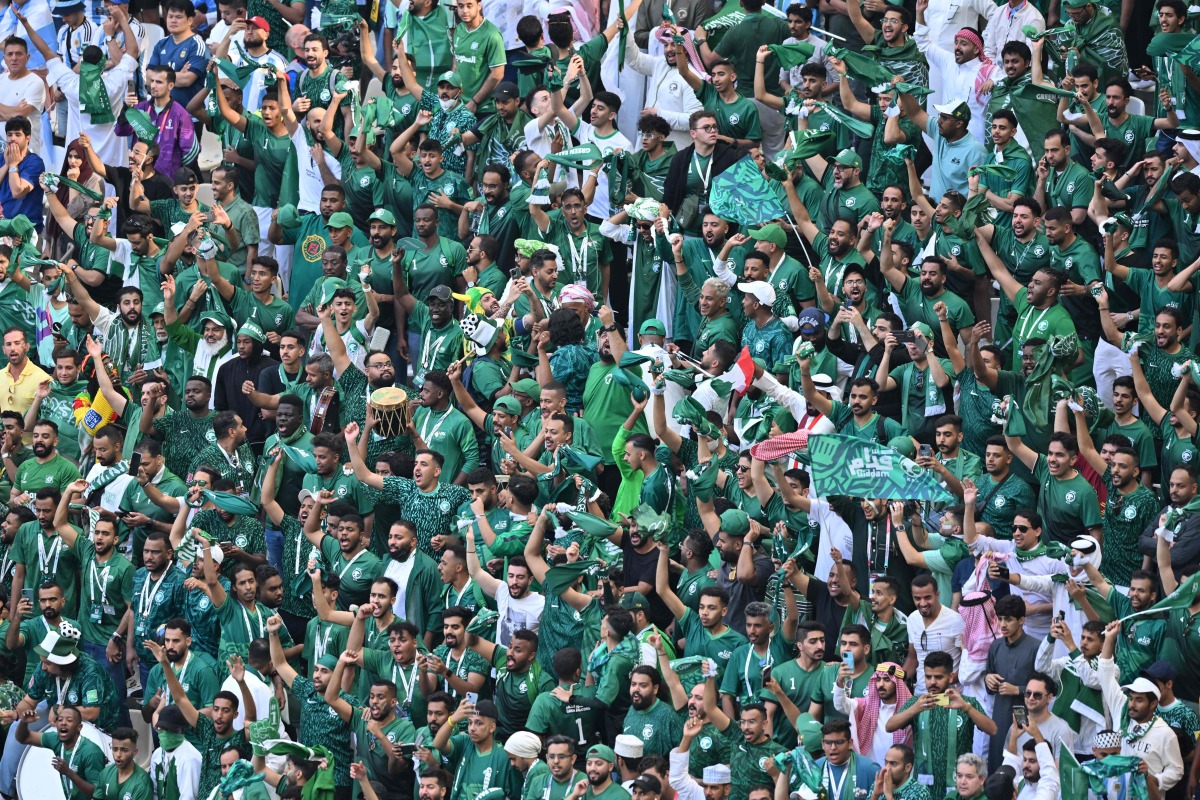 Saudi Arabia fans celebrate their team’s victory in the FIFA World Cup Qatar 2022 Group C match against Argentina at the Lusail Stadium, yesterday. (Reuters)