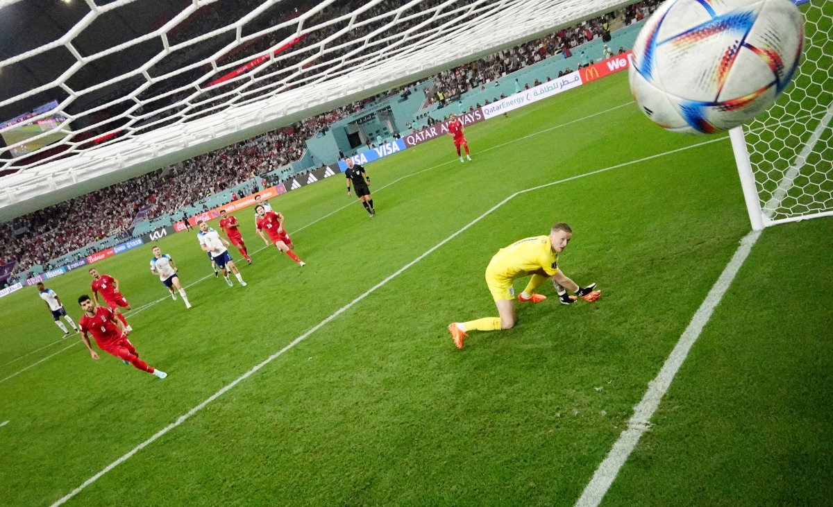 Iran’s Mehdi Taremi scores their second goal from the penalty spot past England’s Jordan Pickford. REUTERS