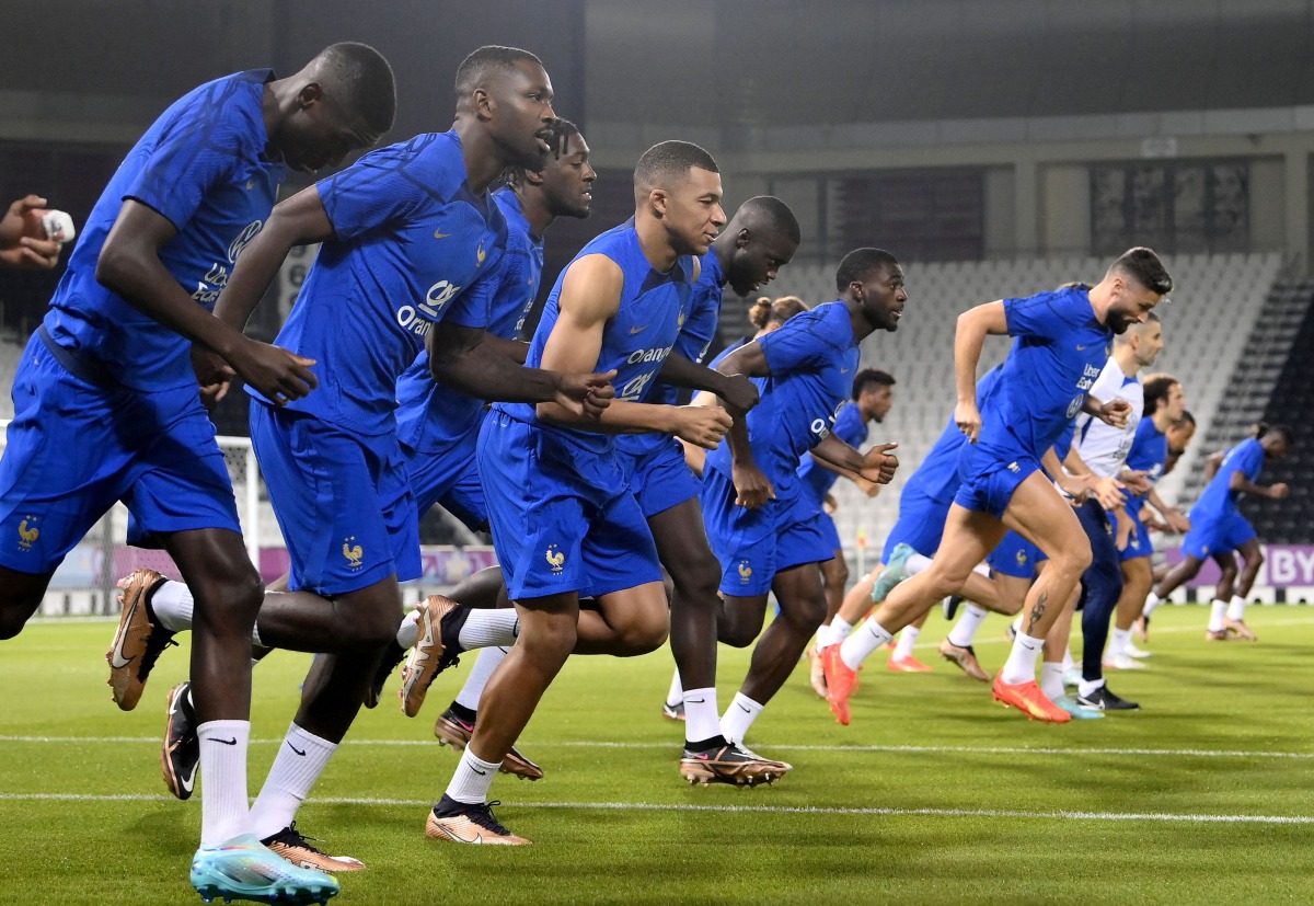 France’s forward Kylian Mbappe and teammates take part in a training session at the Jassim Bin Hamad Stadium in Doha. 