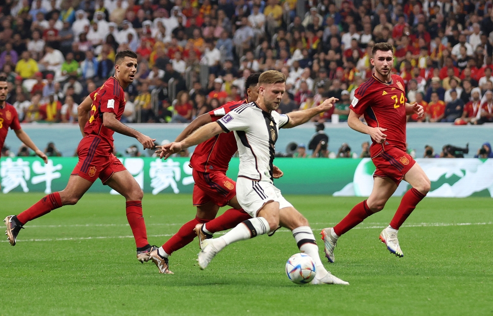 Germany's Niclas Fullkrug scores their equaliser against Spain during the FIFA World Cup Qatar 2022 Group E match at the Al Bayt Stadium, Al Khor, Qatar, on November 27, 2022. REUTERS/Matthew Childs
 