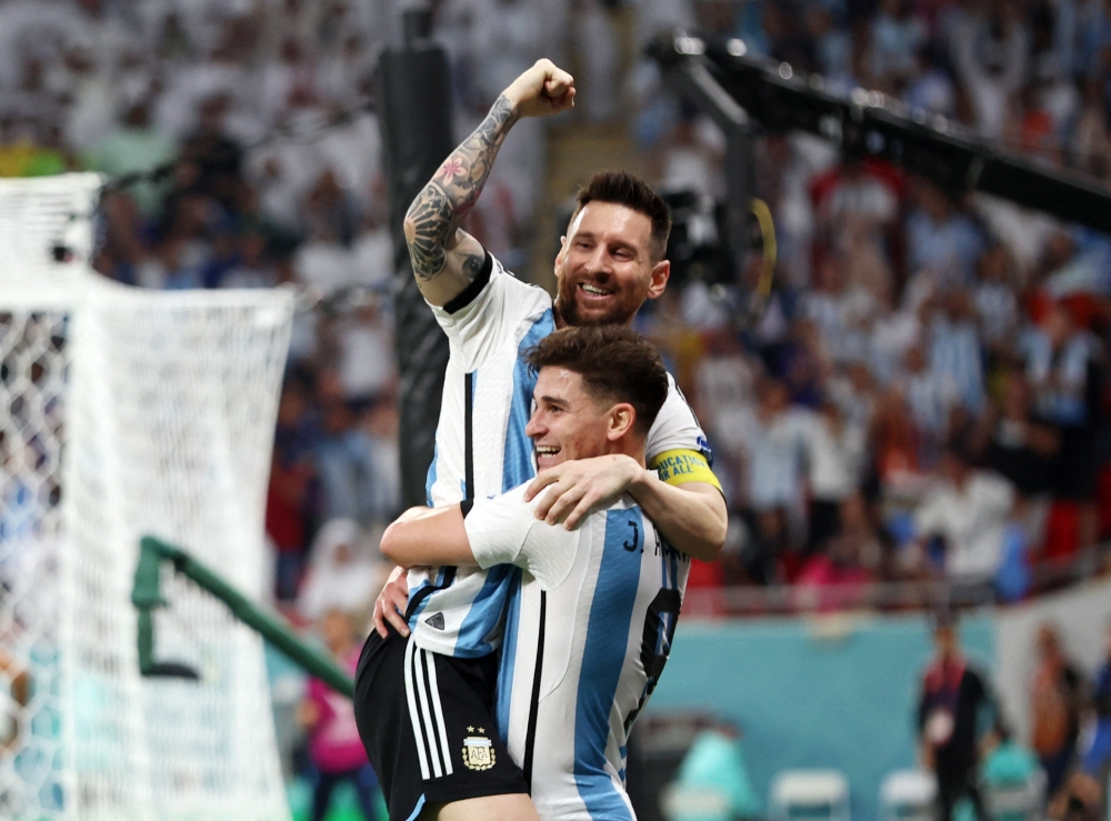 Argentina's Julian Alvarez celebrates scoring their second goal with Lionel Messi during the FIFA World Cup Qatar 2022 round of 16 match against Australia at the Ahmad bin Ali Stadium, Al Rayyan, Qatar, on December 3, 2022. Reuters/Pedro Nunes