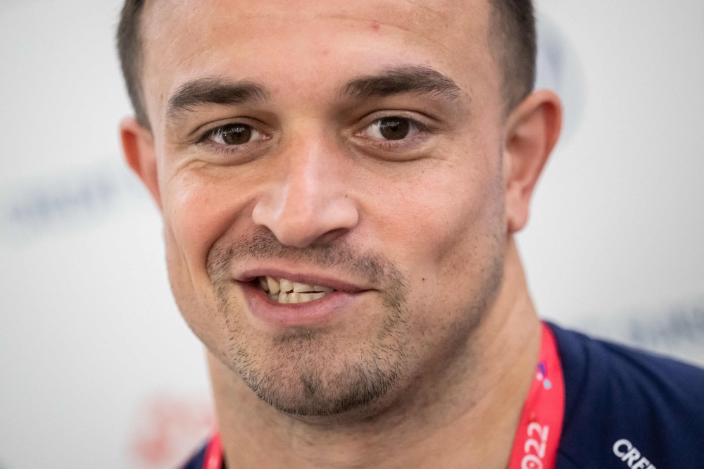 Switzerland's midfielder #23 Xherdan Shaqiri speaks with journalists at the University of Doha for Science and Technology in Doha on December 4, 2022, during of the Qatar 2022 World Cup football tournament. (Photo by Fabrice COFFRINI / AFP)