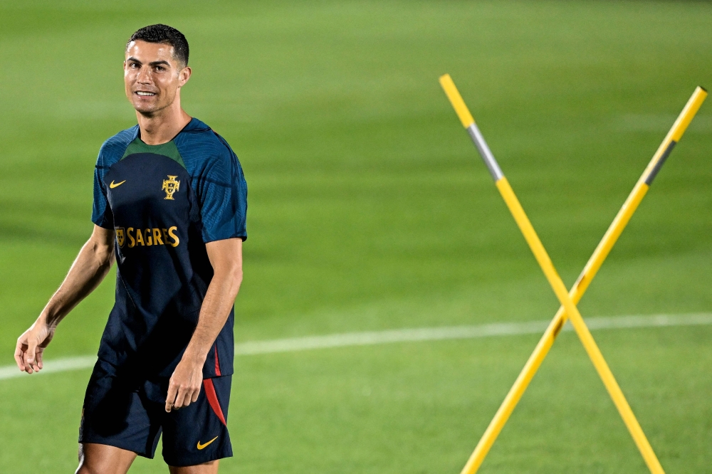 Portugal's forward Cristiano Ronaldo takes part with his teammates in a training session at Shahaniya Sports Club of Al Samriya Autograph Collection Hotel in Al Samriya, northwest of Doha on December 4, 2022 during the Qatar 2022 World Cup football tournament. (Photo by PATRICIA DE MELO MOREIRA / AFP)