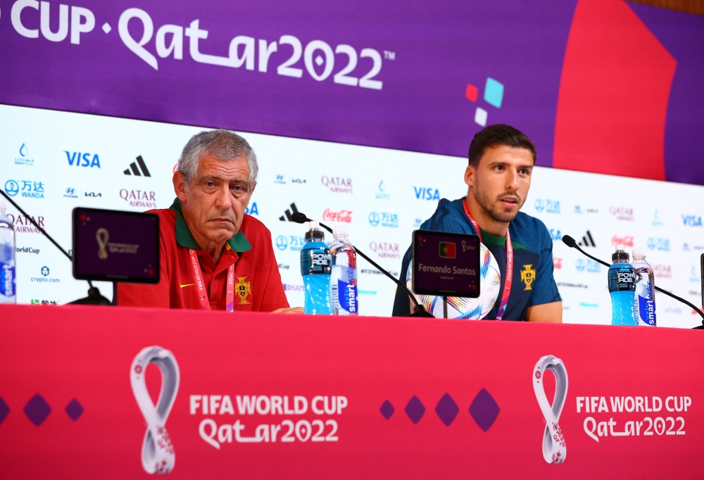 Portugal coach Fernando Santos and Ruben Dias during a press conference at the Main Media Center, Doha, Qatar, on December 5, 2022.  REUTERS/Gareth Bumstead