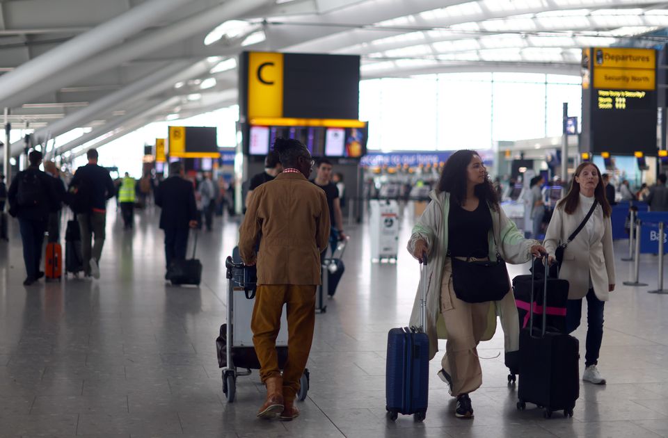 Passengers walk with their luggage through Heathrow Terminal 5 airport in London, Britain, on June 1, 2022. File Photo / Reuters
