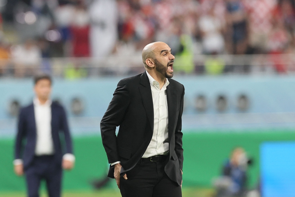 Morocco's coach Walid Regragui reacts from the sidelines during the Qatar 2022 World Cup third place play-off football match between Croatia and Morocco at Khalifa International Stadium in Doha on December 17, 2022. (Photo by KARIM JAAFAR / AFP)