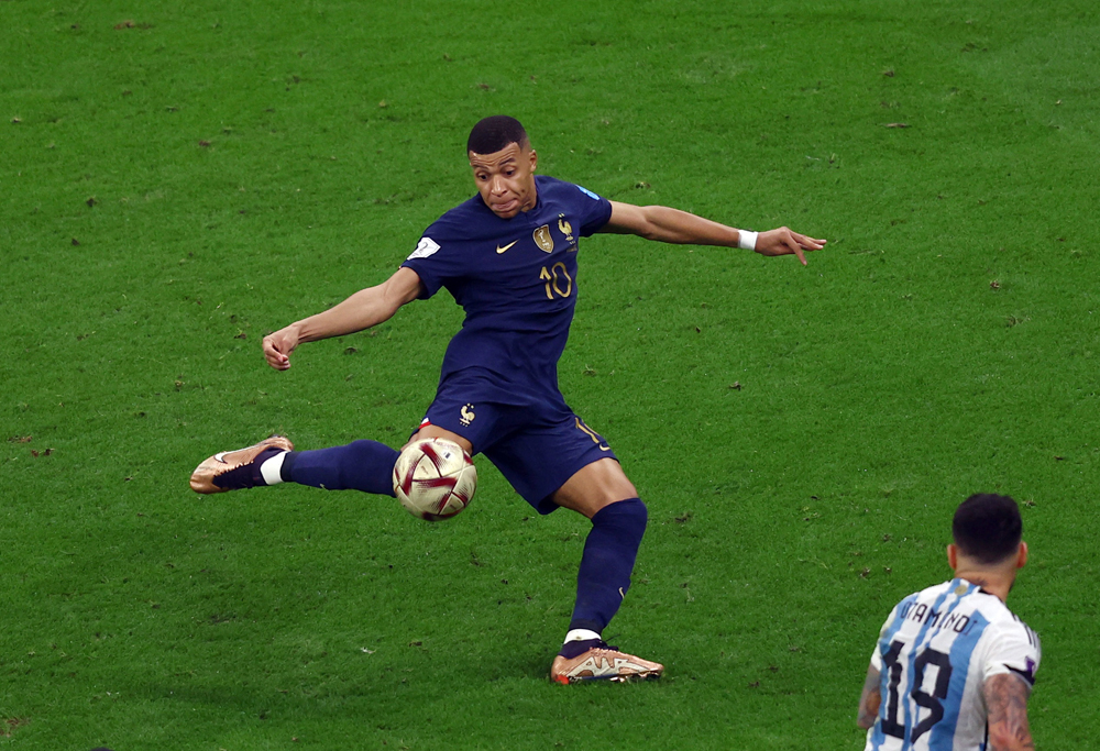 France’s Kylian Mbappe scores his second goal against Argentina, yesterday. REUTERS