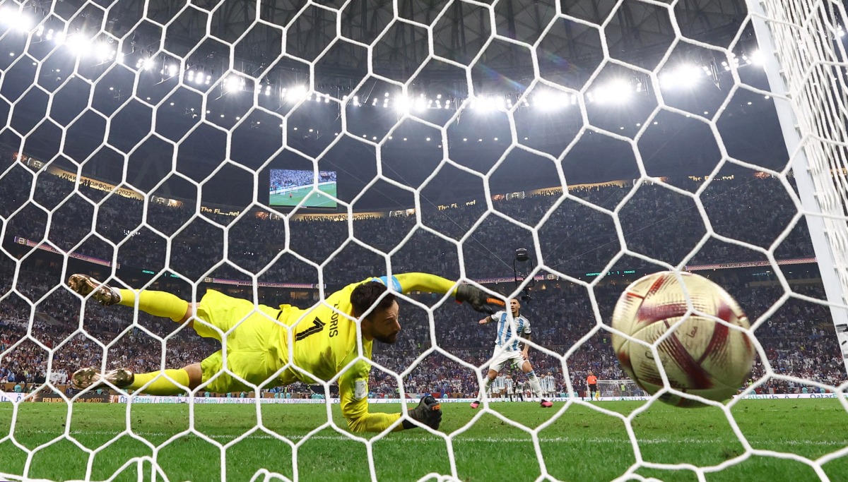 Argentina’s Leandro Paredes scores a penalty during the penalty shootout past France’s Hugo Lloris. REUTERS