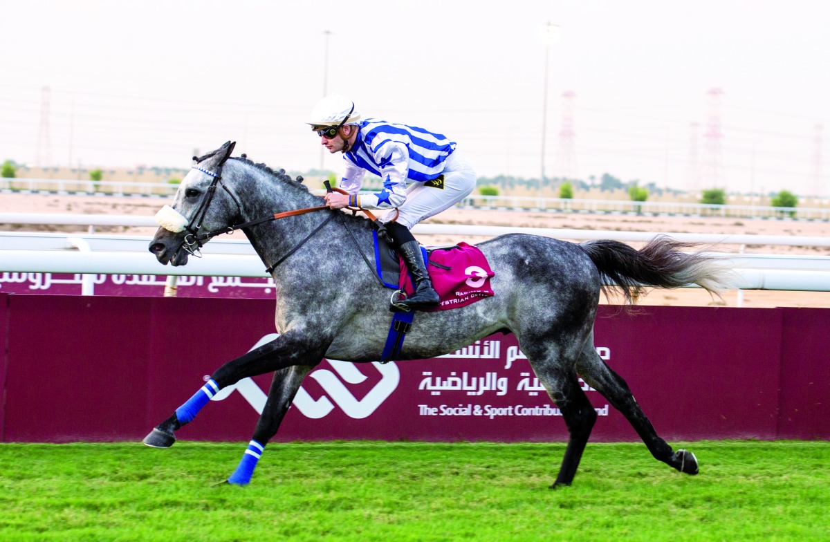 Jockey Lukas Delozier guides Amyr Du Soliel towards the finish line at Al Uqda Racecourse, yesterday. Pic: Juhaim