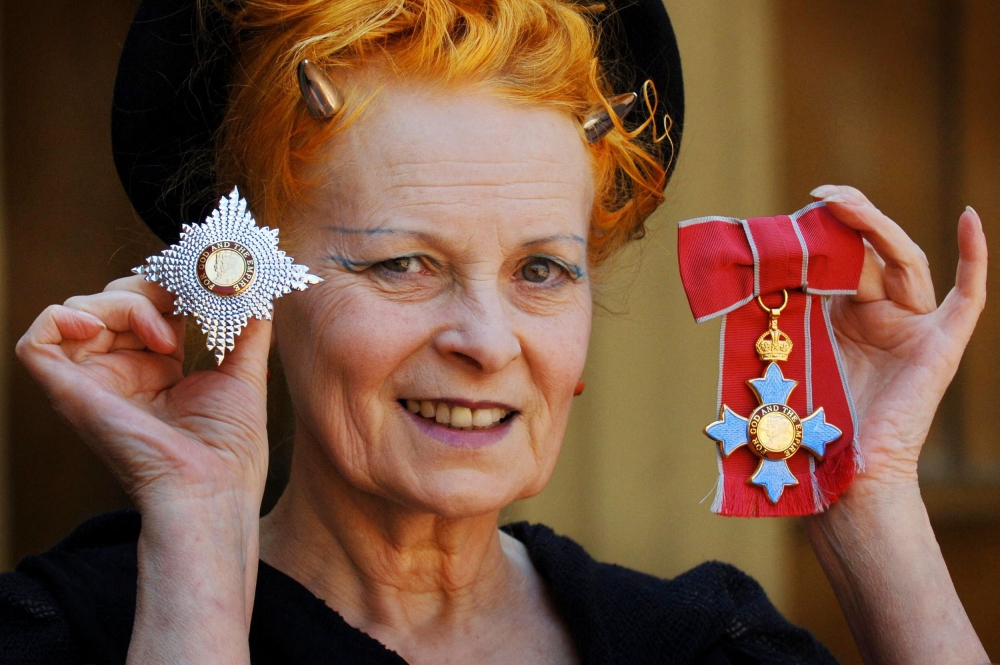 In this file photo taken on June 09, 2006, British Fashion designer Dame Vivienne Westwood poses for photographers after collecting her ensignia from the Prince of Wales during an Investiture ceremony at Buckingham Palace in London. (Photo by Fiona Hanson / POOL / AFP)