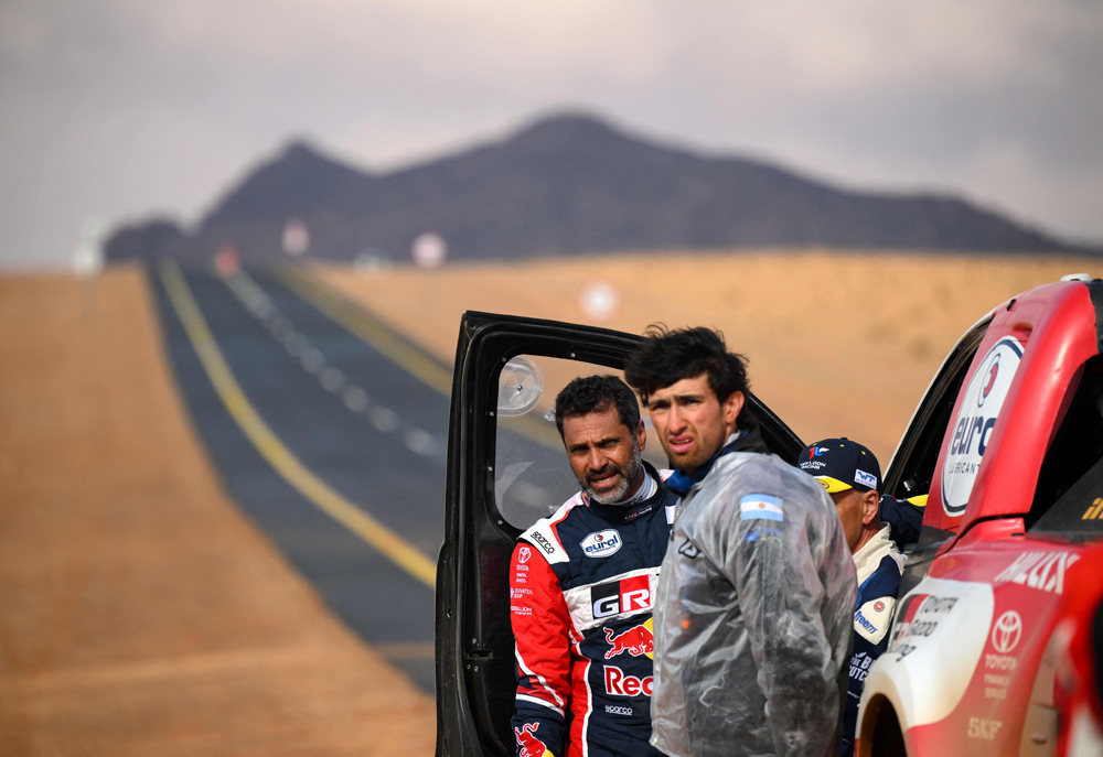 Nasser Al Attiyah of Qatar (left) reacts after the Stage 3 of the Dakar Rally. AFP
