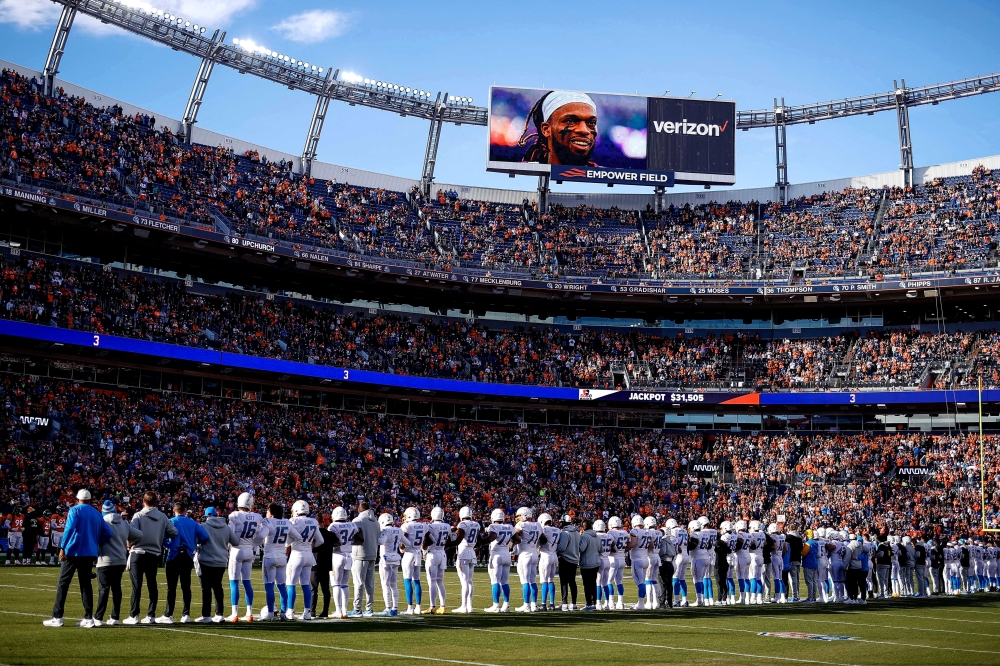 Los Angeles Chargers and Denver Broncos players stand for a moment of silence to honor Buffalo Bills player Damar Hamlin in the first quarter at Empower Field at Mile High, Denver, Colorado, US, January 8, 2023. (Isaiah J. Downing-USA TODAY Sports via Reuters)