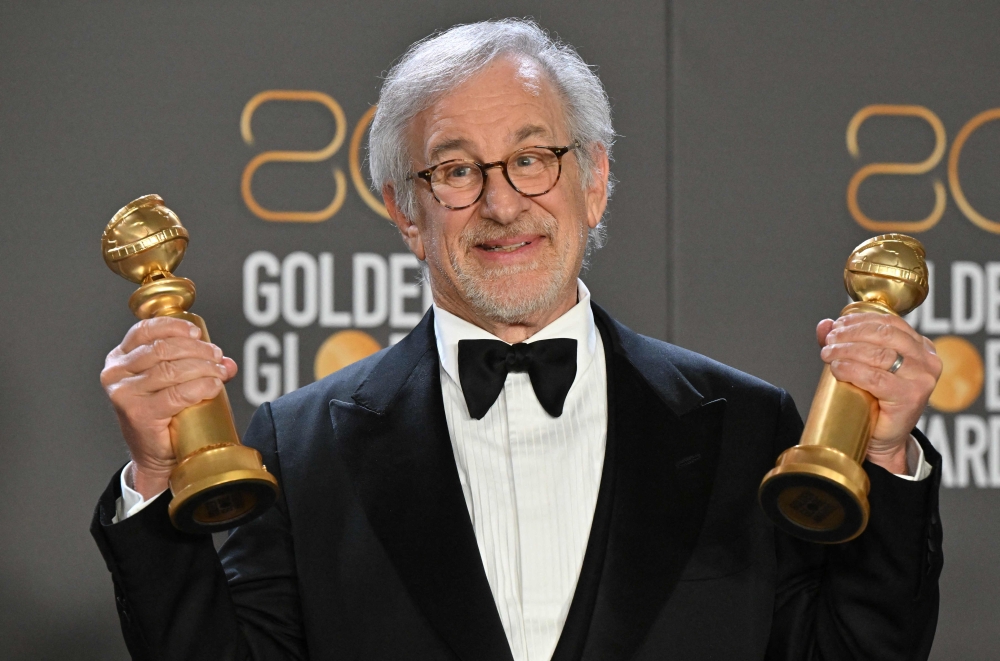 US director Steven Spielberg poses with the awards for Best Director - Motion Picture and Best Picture - Drama for 