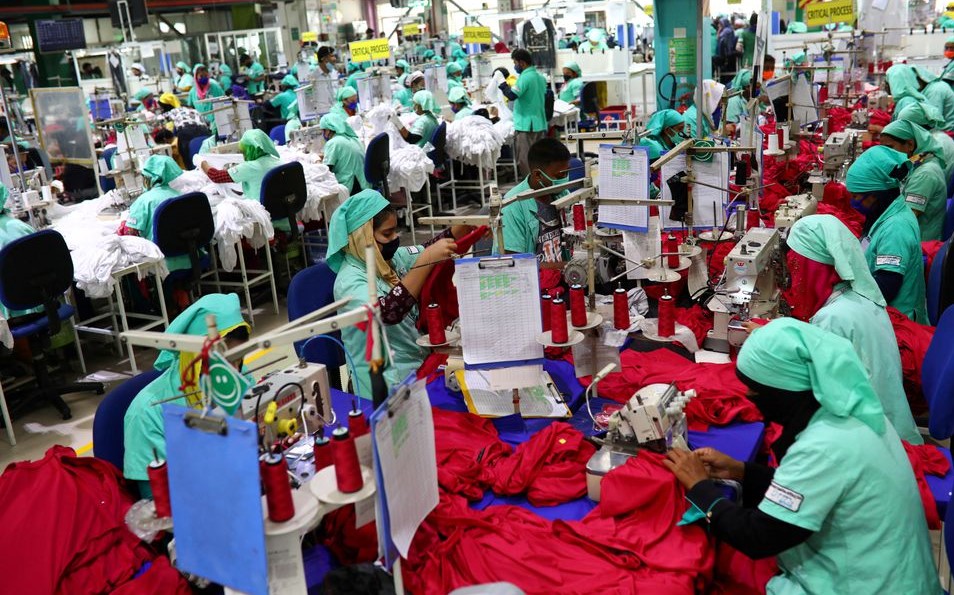 File Photo: Garment employees work in a sewing section of the Fakhruddin Textile Mills Limited in Gazipur, Bangladesh, February 7, 2021. (REUTERS/Mohammad Ponir Hossain)