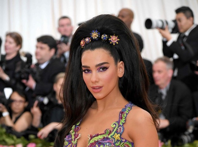 In this file photo taken on May 6, 2019, Albanian singer Dua Lipa attends The 2019 Met Gala Celebrating Camp: Notes on Fashion at the Metropolitan Museum of Art in New York City. (Photo by Neilson Barnard / AFP)