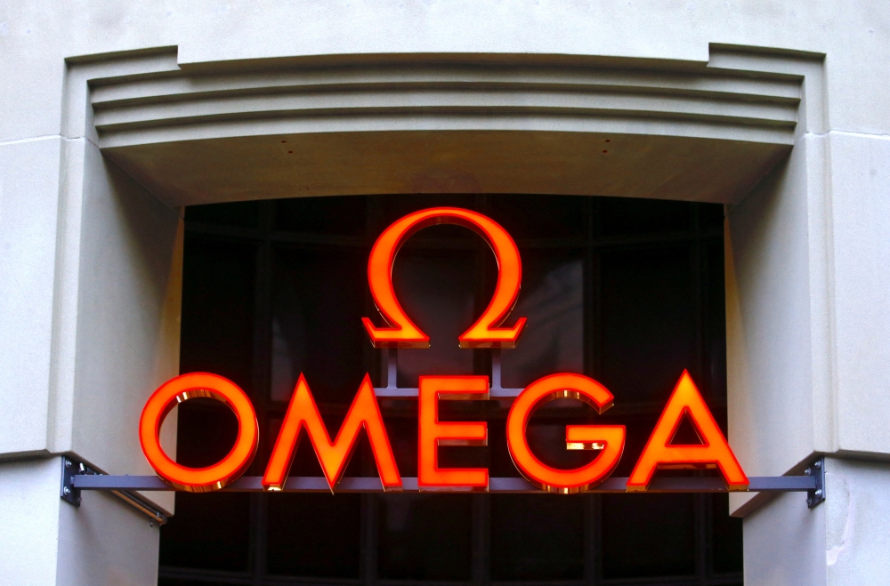 The logo of Swiss watch manufacturer Omega, owned by Swiss Swatch Group, is seen at a shop in Zurich, Switzerland July 8, 2021. REUTERS/Arnd Wiegmann/File Photo