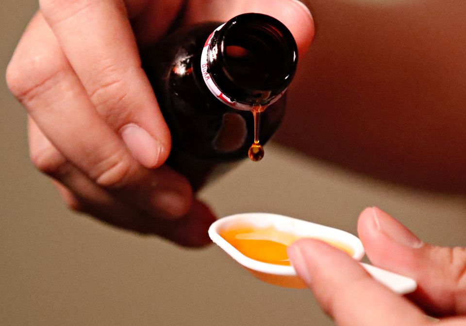 A cough medication is poured in this picture illustration taken October 19, 2022. File Photo: Ajeng Dinar Ulfiana/Illustration/Reuters
