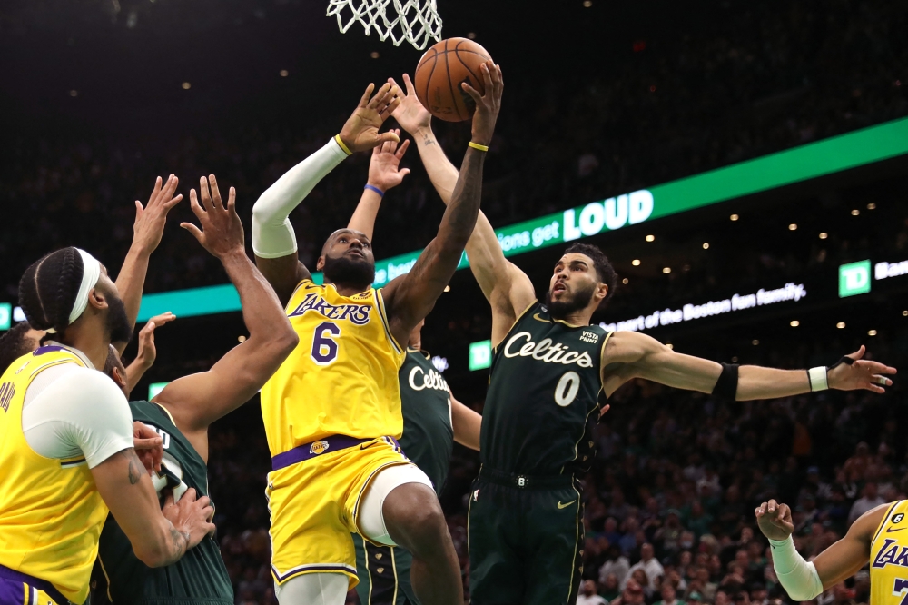 Jayson Tatum #0 of the Boston Celtics defends LeBron James #6 of the Los Angeles Lakers in the final shot of regulation play during the fourth quarter at TD Garden in Boston, Massachusetts, on January 28, 2023. (Photo by Maddie Meyer / Getty Images via AFP)