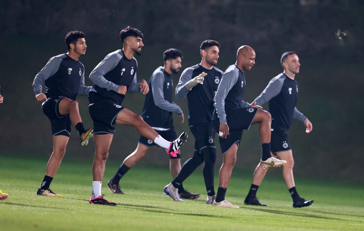 Al Sadd players in action during a training session.