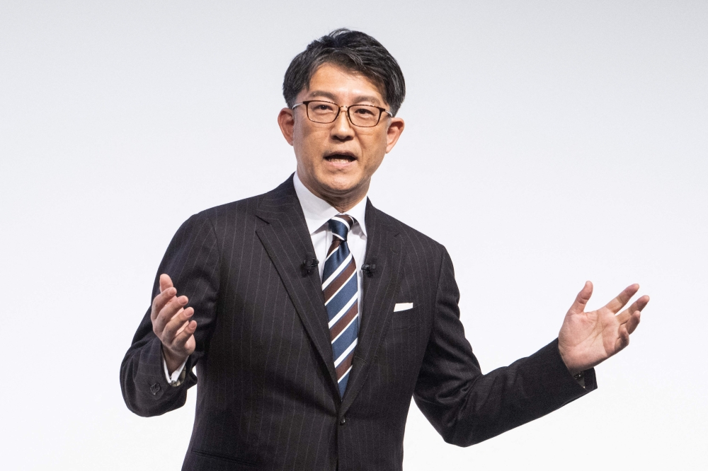 Koji Sato, Chief Branding Officer and CEO-designate of Toyota Motors speaks during a press conference in Tokyo on February 13, 2023. (Photo by Yuichi YAMAZAKI / AFP)