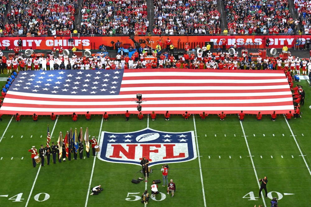 US singer-songwriter Chris Stapleton performs the US national anthem ahead of Super Bowl LVII between the Kansas City Chiefs and the Philadelphia Eagles at State Farm Stadium in Glendale, Arizona, on February 12, 2023. (Photo by ANGELA WEISS / AFP)