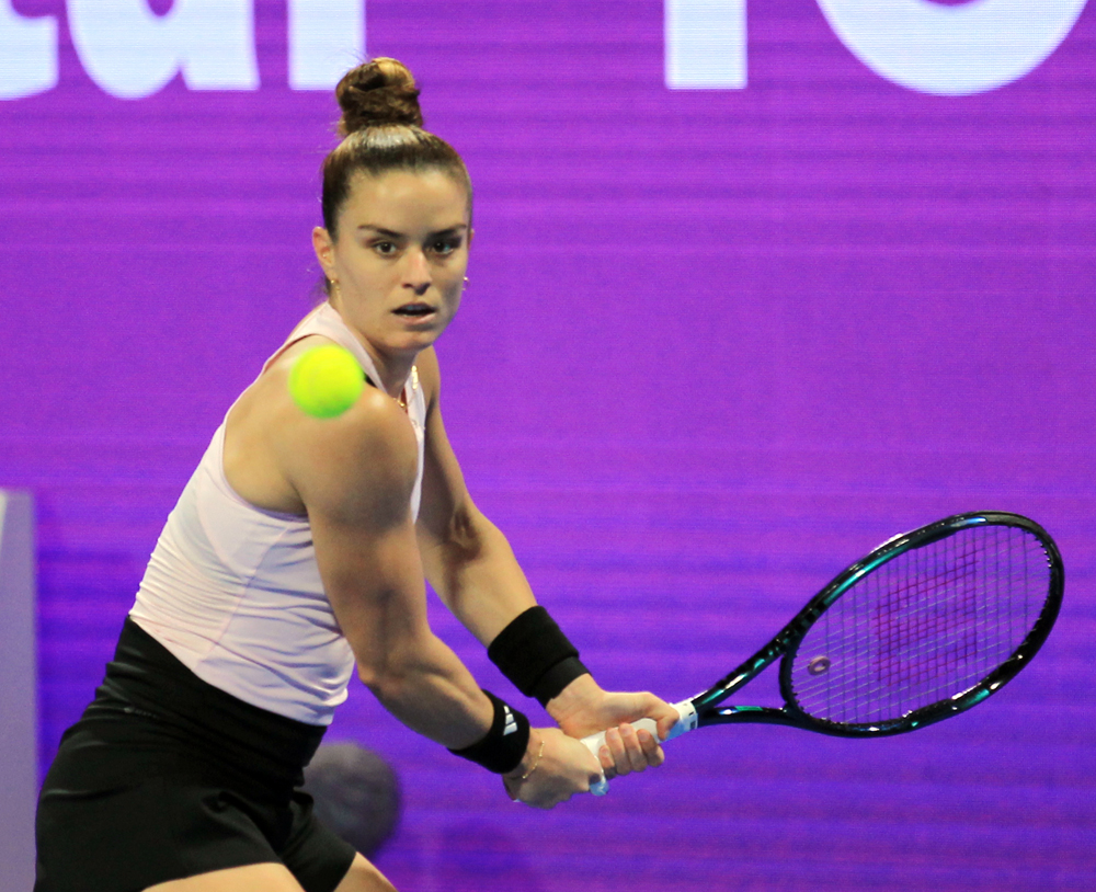 Maria Sakkari of Greece hits a return shot against Zheng Qinwen of China during their Round of 32 match at the Khalifa International Tennis & Squash Complex in Doha, yesterday.  Pictures: Salim Matramkot/The Peninsula