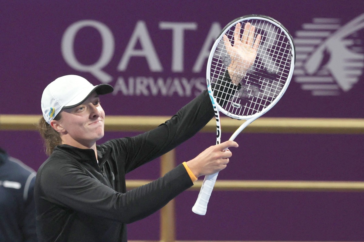 Iga Swiatek of Poland reacts after winning her singles match of the Qatar TotalEnergies Open against Danielle Collins of the US, yesterday. AFP