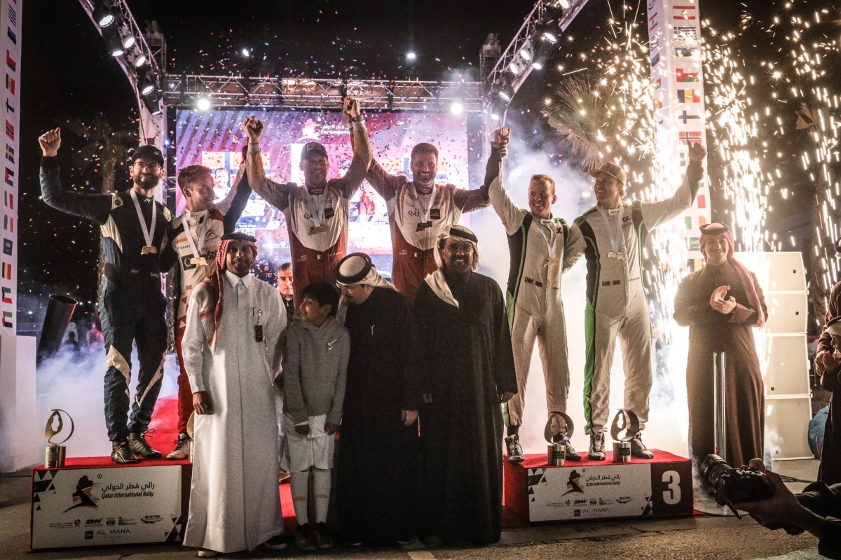 QMMF President Abdulrahman Al Mannai and QMMF Executive Director Amro Al Hamad pose with podium winners. 