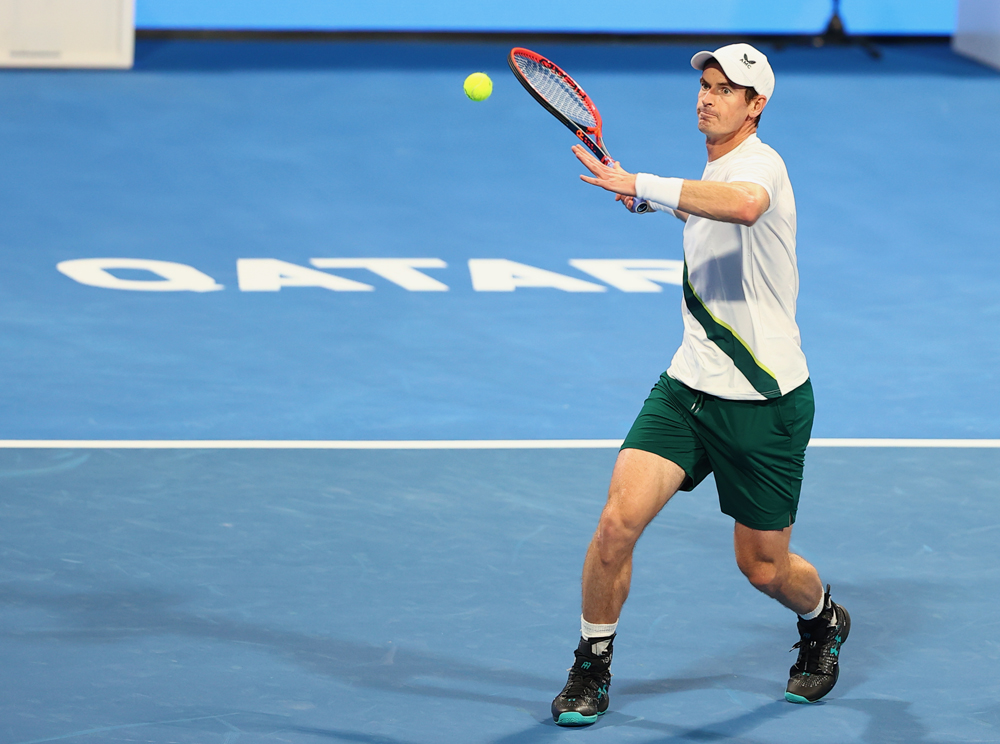 Great Brittain's Andy Murray hits a return against Italy's Lorenzo Sonego during their first round match of the Qatar ExxonMobil Open, yesterday. 