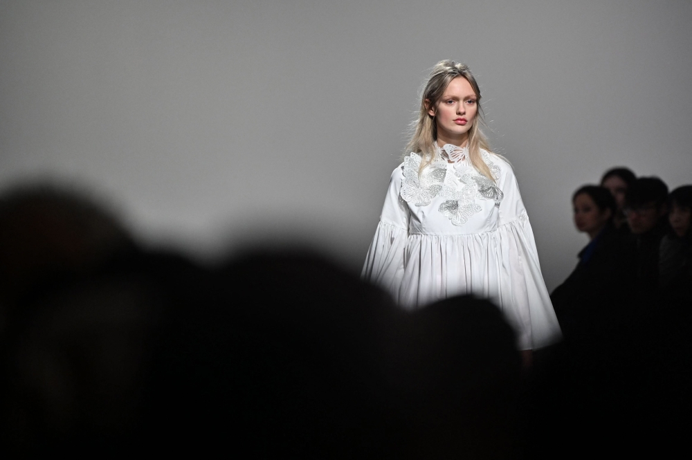 A model presents a creation for Paskal during the Autumn/Winter 2023 Ukrainian fashion week show collection on the fifth day of the London Fashion Week, in London, on February 21, 2023. (Photo by JUSTIN TALLIS / AFP) 